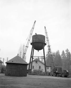 [Cranes being used to build a water tower]
