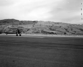 [Bi-plane landing at Kamloops Airport]