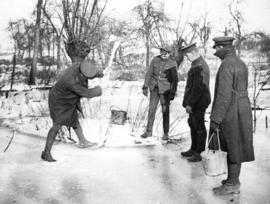 [Soldiers break ice to collect water for cooking on the Western Front]