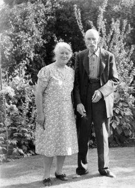 Mr. and Mrs. James L. Quiney [in the garden at] 4916 Union Street, Burnaby