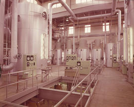 Completed new pan house: interior view of large tanks and control panels
