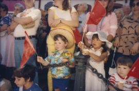 Children waving red flags