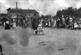 [A man and his dog in a Labour Day parade on Hastings Street]