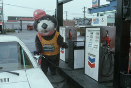 Tillicum pumping gas at Chevron station on 4th Avenue and Macdonald Street