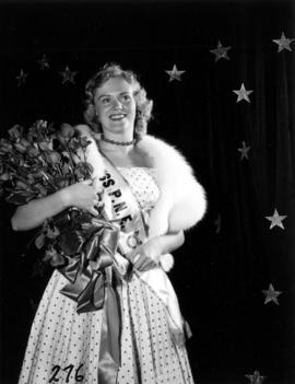 Miss P.N.E., Glenda Sjoberg, posing with roses