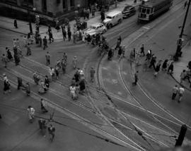 [View of pedestrians crossing at the intersection of Hastings and Granville Streets taken from ab...