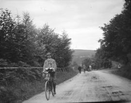 [Jean and John Davidson on bicycle]