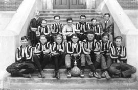 [Mr. Gray and the football team on the steps of Edith Clavell School at the corner of Tupper Stre...