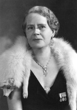 [Mrs. J.S. Matthews wearing a white fox stole]