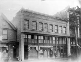 [Mr. Francis (Frank) J. Hamilton standing on the 100 block East Pender Street]