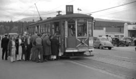 [Passengers climbing aboard the Joyce Street street car]