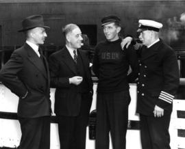 [Gerald Rushton; J. Douglas Dingwall, Chief Ticket Agent; unidentified crewman; Capt. H.E. Lawrey]