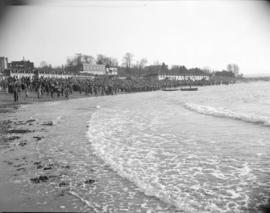 [Large crowd on the beach at English Bay]