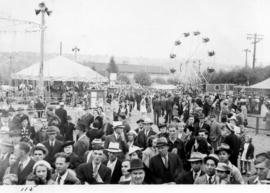 Crowd in midway carnival on Vancouver Exhibition grounds