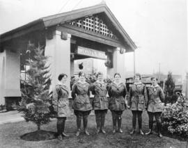 [Gasoline attendants in front of the Imperial Oil Company Limited station on the southeast corner...