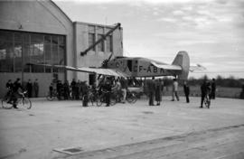 [A CF-ABK airplane outside a hangar]