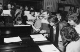 Group around piano at Griffiths Gibson Productions