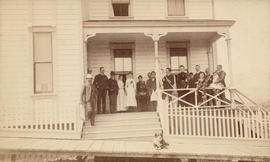 [Group portrait on porch of the Ellesmere Rooms at 439 Homer Street]