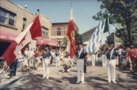 Fire Department Band members marching with flags