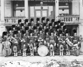 [Brass band of the 72nd regiment of the Seaforth Highlanders assembled on steps of the Elysium Ho...