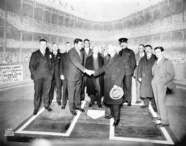 [Babe Ruth shaking Mayor L.D. Taylor's hand on Pantages Theatre stage]