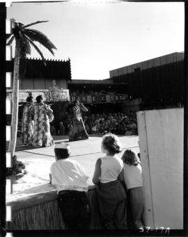 Crowd watching Hawaiian dancers on Electrical building stage