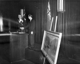 [Mayor Fred J. Hume receives a painting by John Innes from Ronald S. Ritchie]