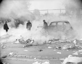 [Firemen in the street extinguishing burning newspapers set on fire by striking workers at the Va...