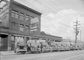 Deeks-McBride Ltd., Main St. : mining trucks and bldg.