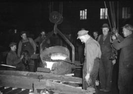 [Workers at a smelting plant]