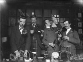 [Brown, Varty, Bullen and Sham in botany laboratory]