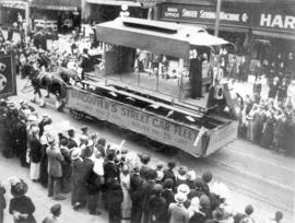 [B.C. Electric horse-drawn float in the 600 Block of Granville Street during a Victoria Day parade]
