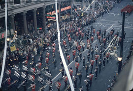 43rd Grey Cup Parade, on Granville Street at West Pender, military marching band, ticker tape, sp...