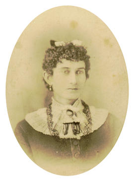 [Head and shoulders studio portrait of a woman in a lace collar]