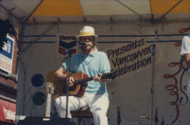 Guitarist performing on Chevron Stage