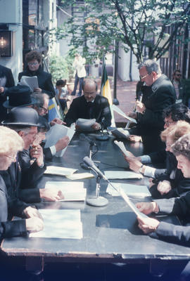 Mike Harcourt at head of table during reenactment of Vancouver's first City Council meeting