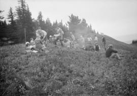 Hiking group sitting in a field