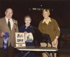 Best in Group [Non-Sporting Group: Schipperke] award being presented at 1976 P.N.E. All-Breed Dog...
