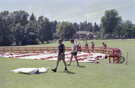 Workers assembled around stage canopy structure