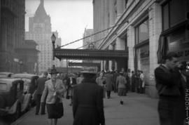 [Pedestrians on Georgia Street outside the Hudson's Bay Co.]