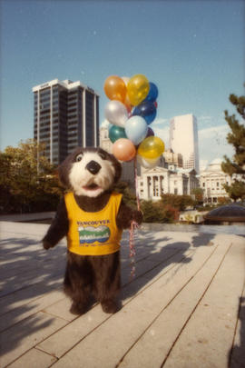 Tillicum holding balloons near 829 Howe Street