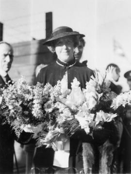 Lady Tweedsmuir with bouquet, presented by Mrs. F.E. Burke upon arrival at C.P.R. dock, August 25...