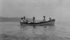 T.C. Pattison and four young women in a rowboat