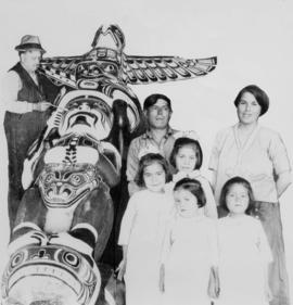 [Charlie James totem pole carver and unidentified family]