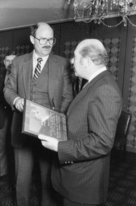 Mike Harcourt and Peter Paul Saunders holding award