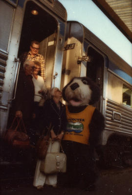 Tillicum greeting group disembarking train at Canadian Pacific station