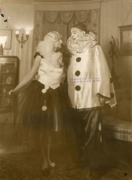 A couple dressed as clowns