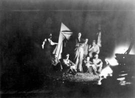 [Unidentified group around a camp fire]