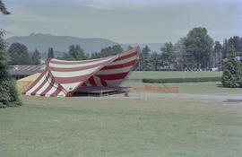 Stage under red and white striped canopy at Stanley Park