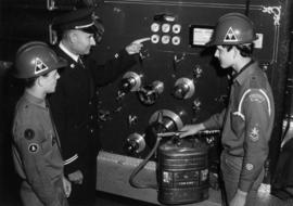 [Vancouver Fire Department staff showing firefighting apparatus to boy scouts]